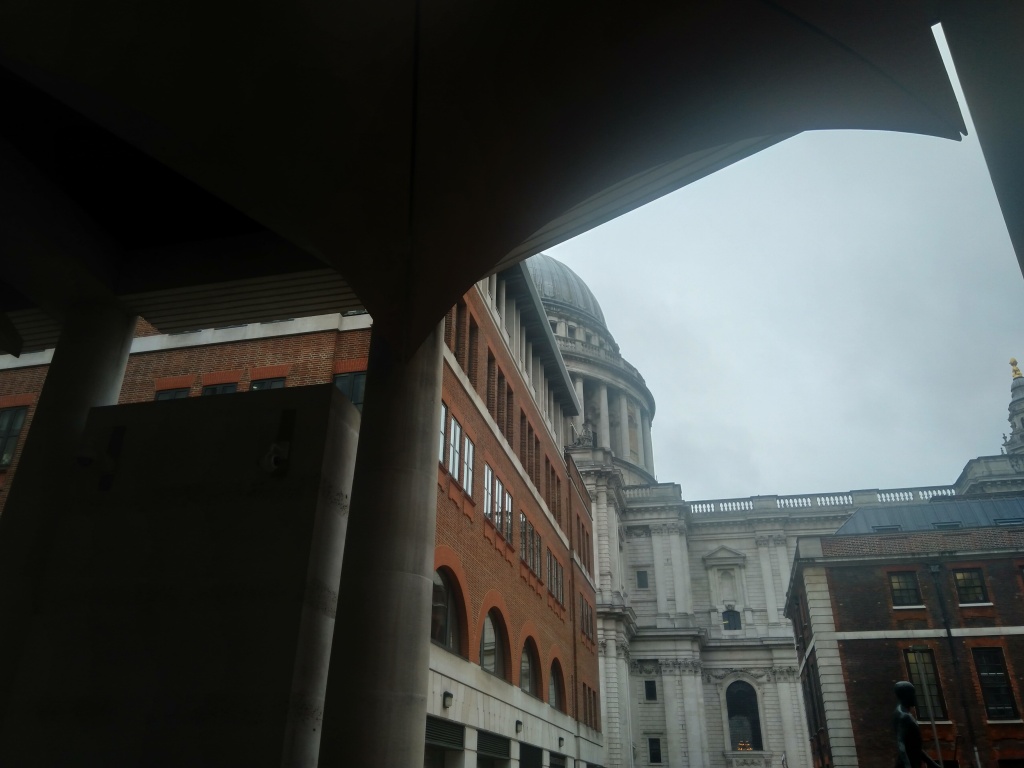 St Paul's partly obscured by modern buildings of Paternoster Square.